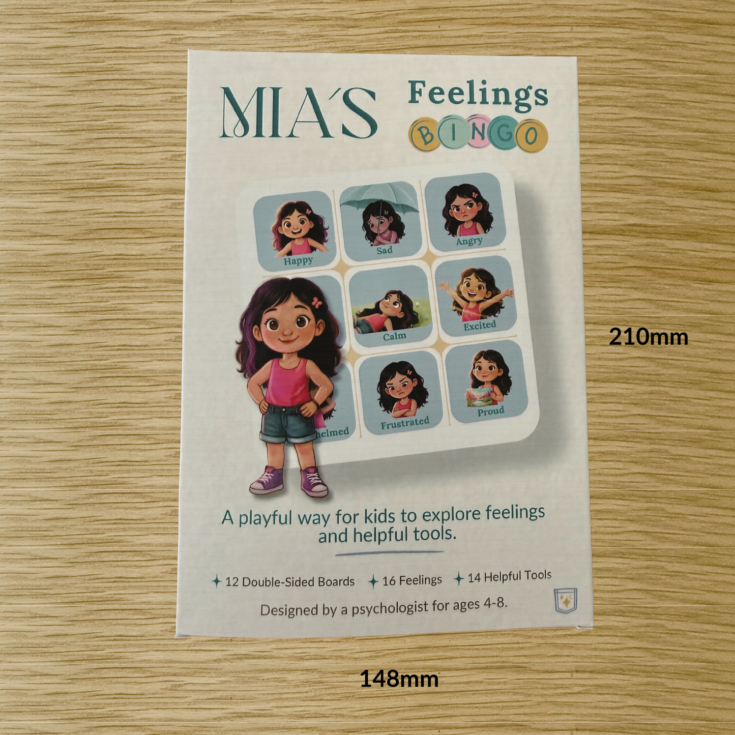 Mia's Feelings Bingo game for emotional literacy on a wooden surface with measurements.