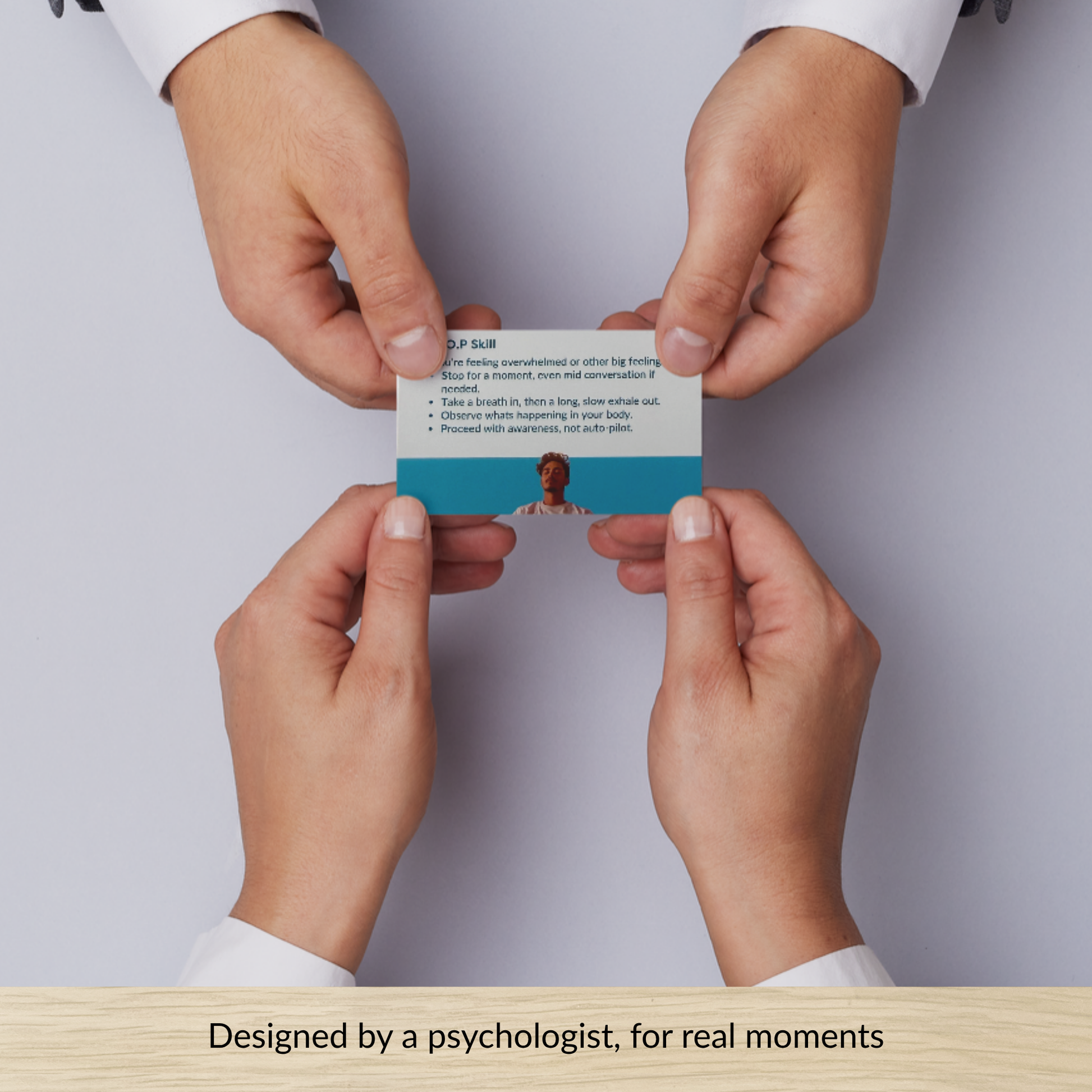 hands holding a calm card showing evidence-based emotional regulation prompt designed by a psychologist