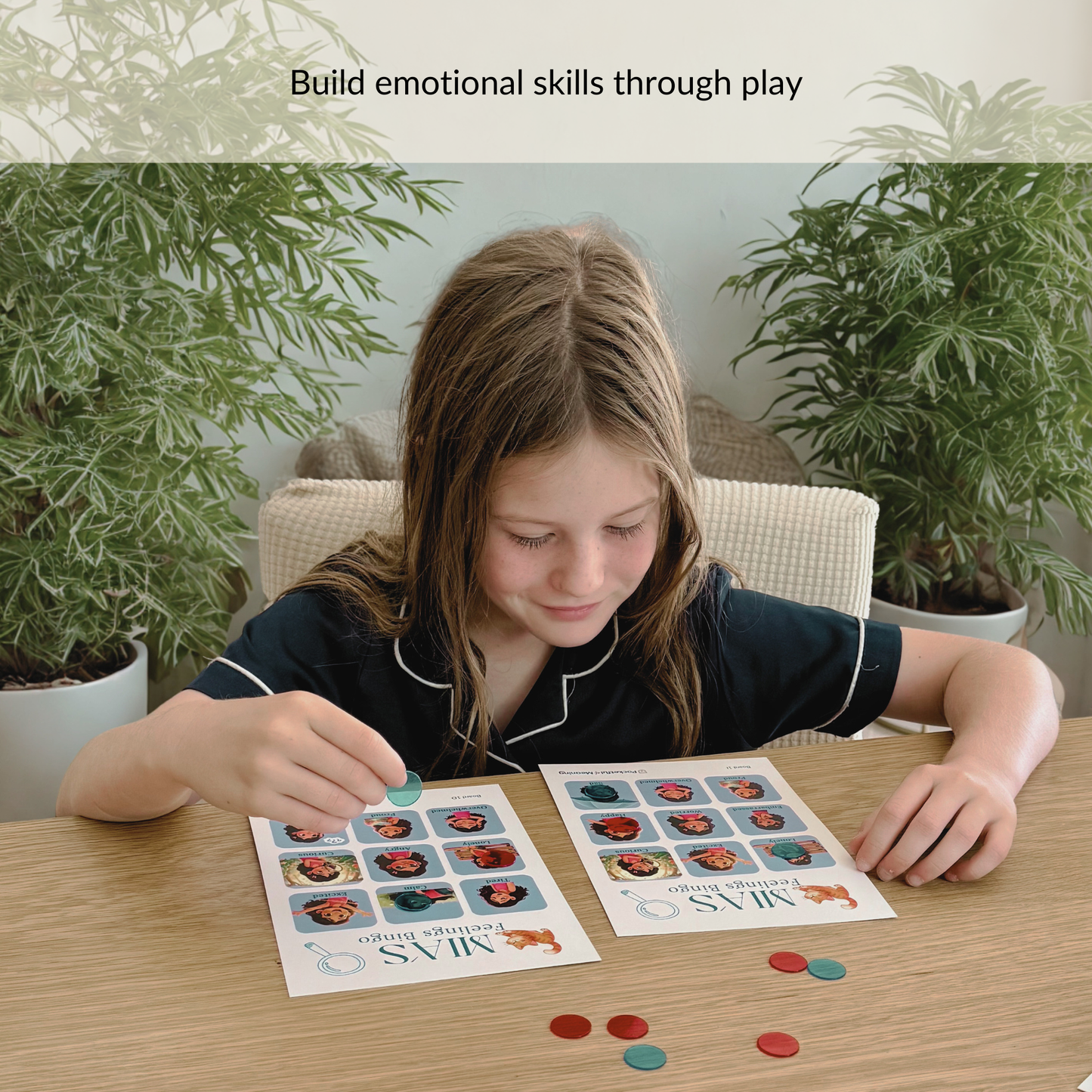 child playing Mia feelings bingo game to build emotional awareness and recognise emotions