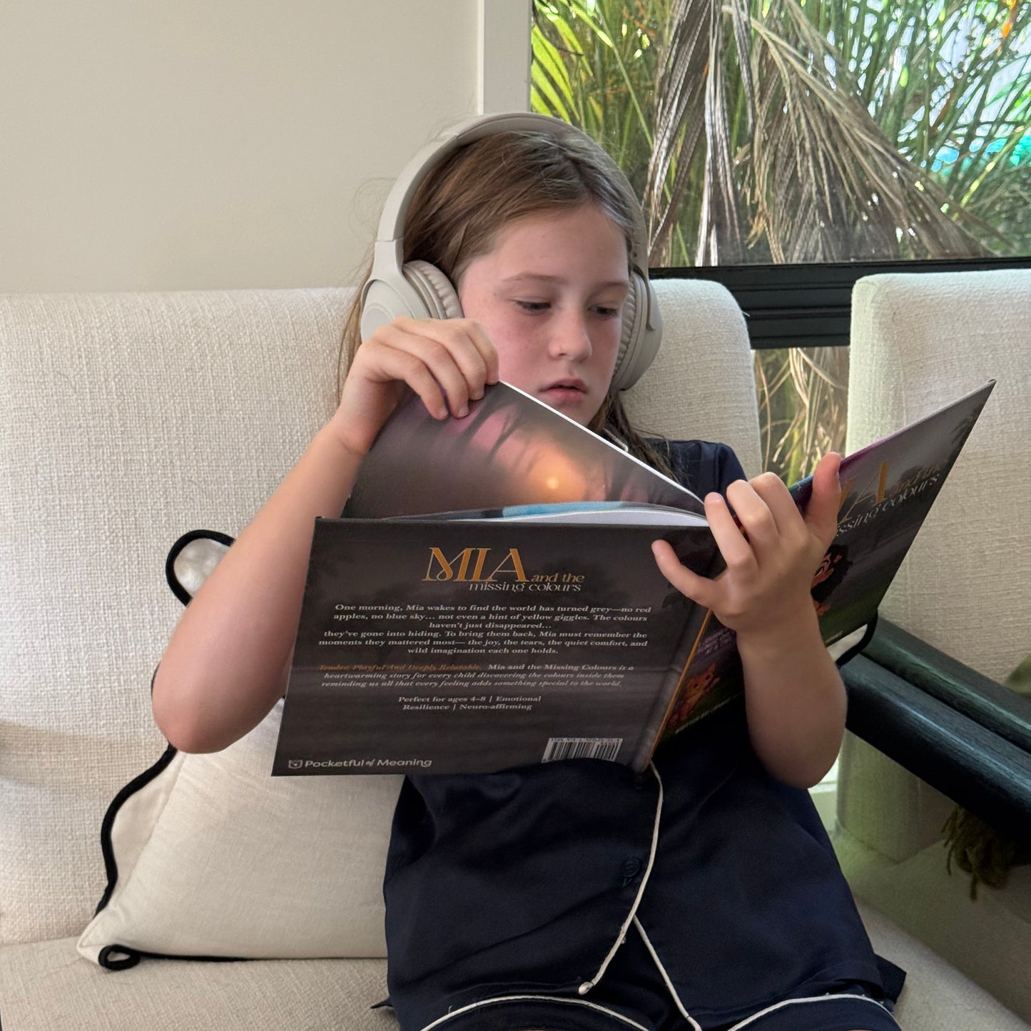 Child reading Mia and the Missing Colours, a gentle story that helps children understand feelings and emotions