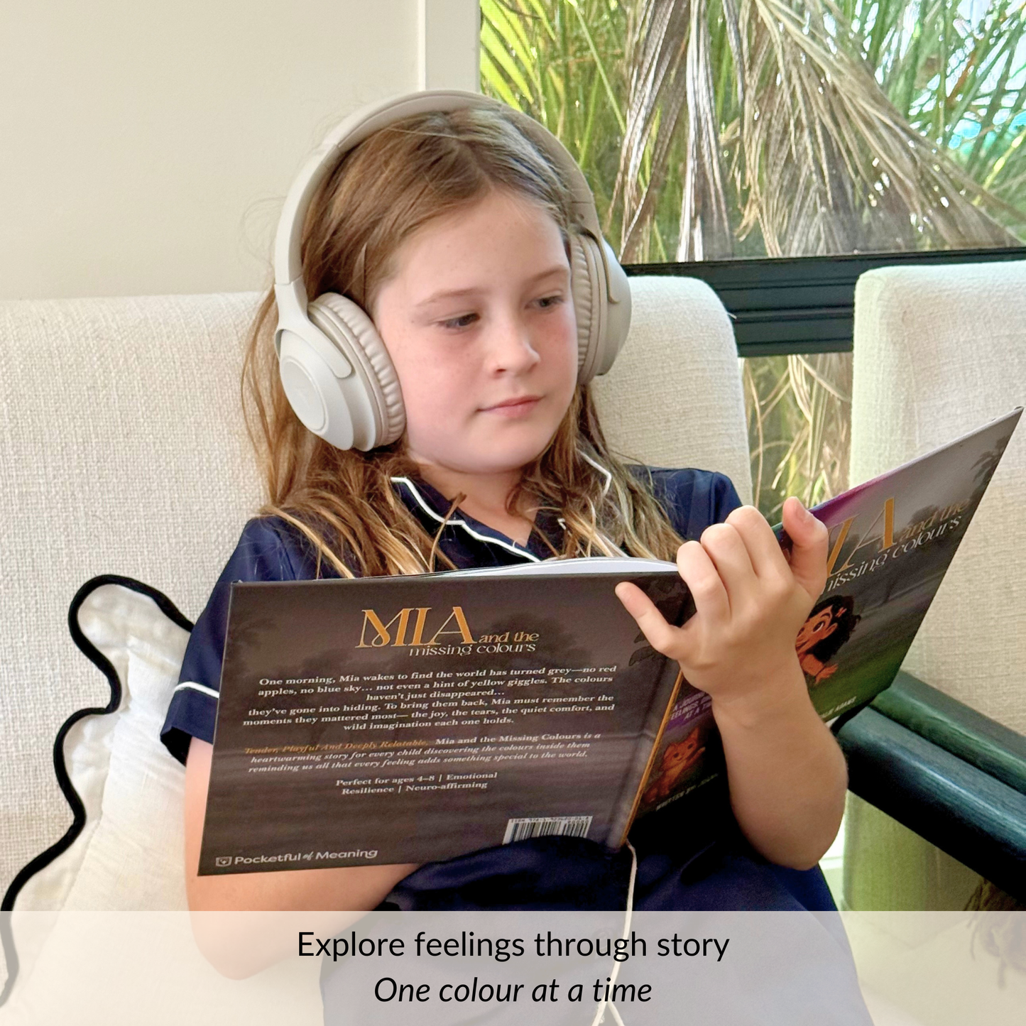 child reading Mia and the Missing Colours book to learn about emotions and feelings through story