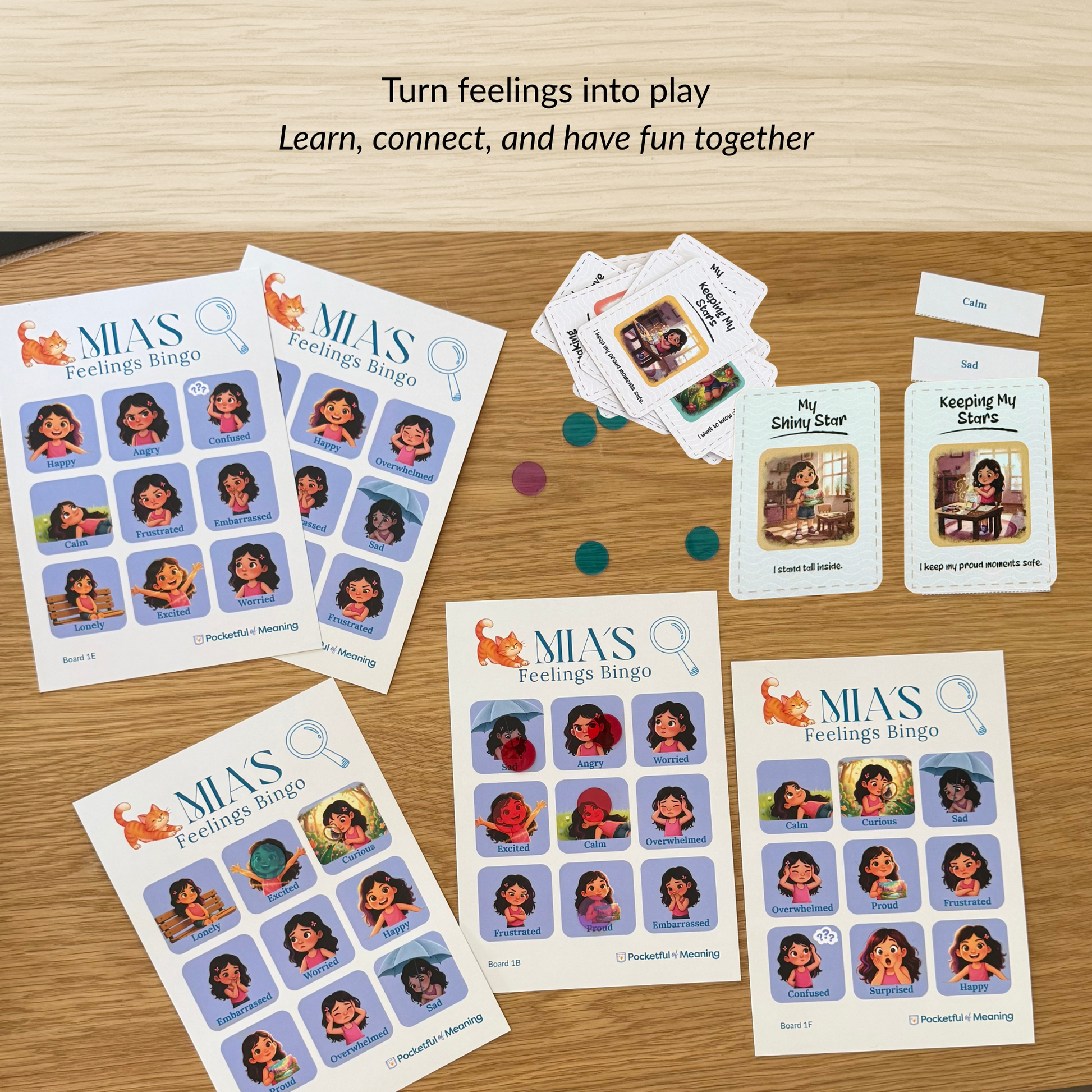 Mia feelings bingo game boards and emotion cards laid out for children’s emotional learning activity